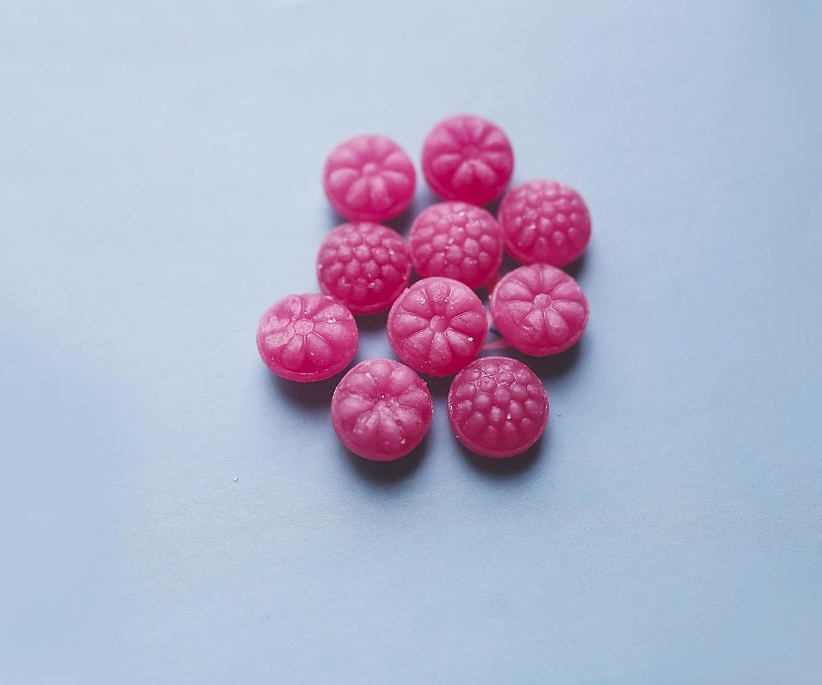 Artisan hands crafting chocolate bonbons with precision